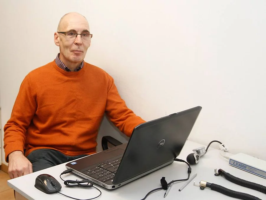 Mike Rumble sitting on his desk